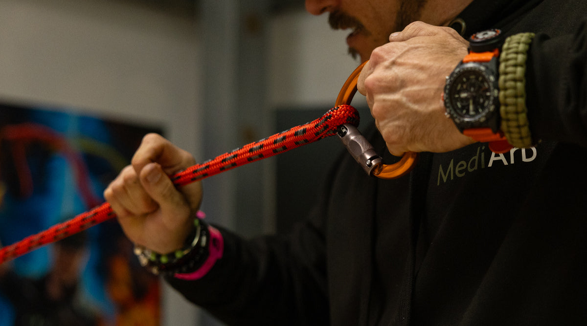 Man pulling on a rope tightening a splice