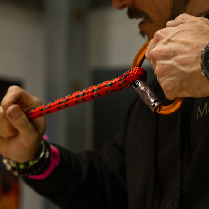 Man pulling on a rope tightening a splice