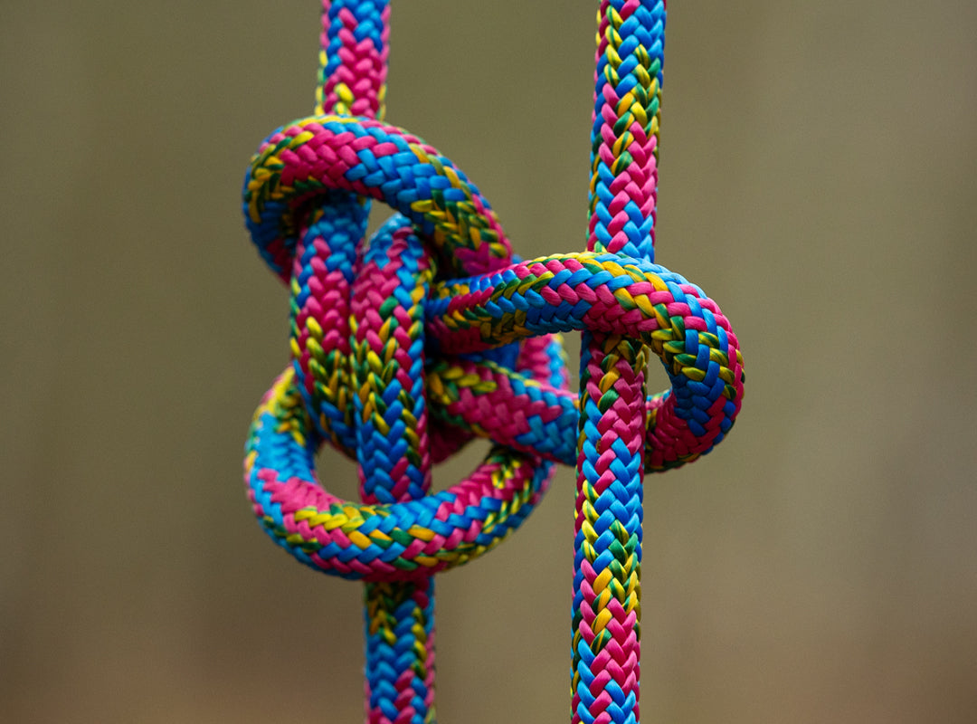 Colorful rope knot against a blurred background